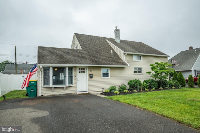 67 Neptune Ln, Levittown, PA 19054 - view of front of property featuring roof with shingles and a chimney
