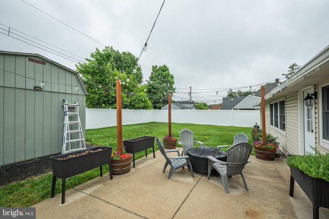 67 Neptune Ln, Levittown, PA 19054 - fenced backyard featuring a fire pit, a patio area, and an outdoor structure