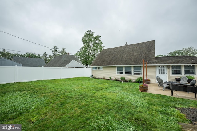 67 Neptune Ln, Levittown, PA 19054 - rear view of property featuring a patio area and a shingled roof