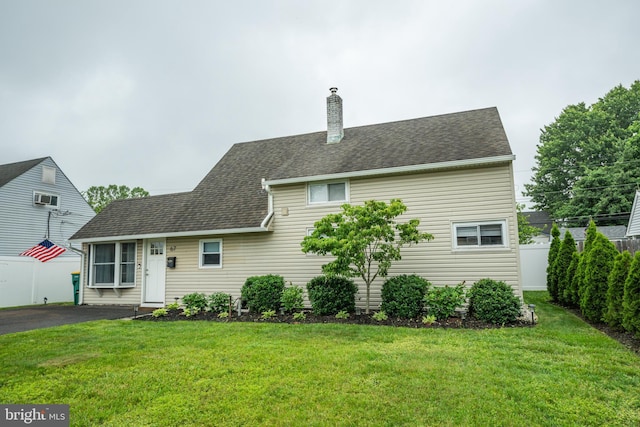 67 Neptune Ln, Levittown, PA 19054 - back of property featuring a chimney and a shingled roof