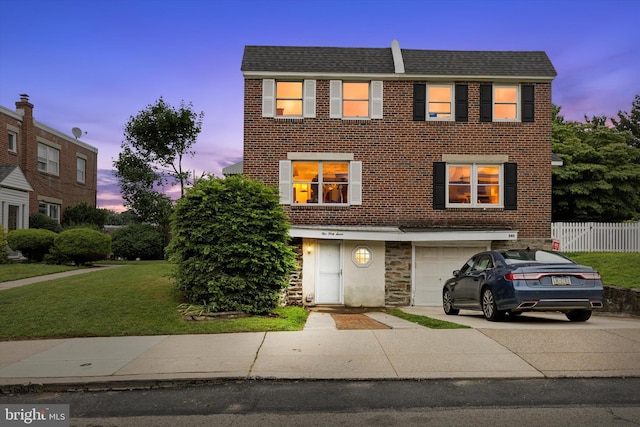 547 Overlook, Philadelphia, PA 19128 - townhome / multi-family property featuring driveway, an attached garage, brick siding, and stone siding