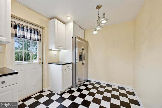547 Overlook, Philadelphia, PA 19128 - kitchen featuring dark flooring, dark countertops, stainless steel fridge, white cabinetry, and decorative light fixtures