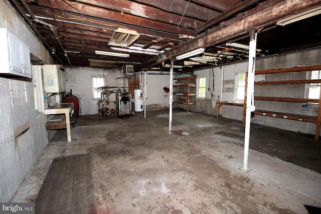 538 N 11th St, Philipsburg, PA 16866 - below grade area with water heater, concrete block wall, and plenty of natural light