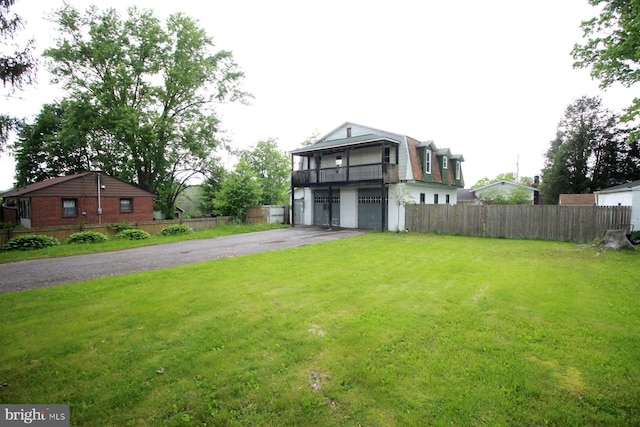 538 N 11th St, Philipsburg, PA 16866 - view of front of property with driveway, a garage, and a balcony