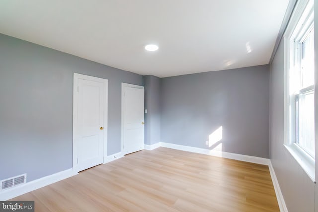 6 Carroll Rd, Catonsville, MD 21228 - unfurnished bedroom featuring light wood-type flooring, multiple windows, and recessed lighting