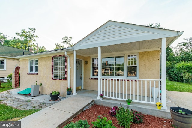 6 Carroll Rd, Catonsville, MD 21228 - view of front of home featuring covered porch and stucco siding