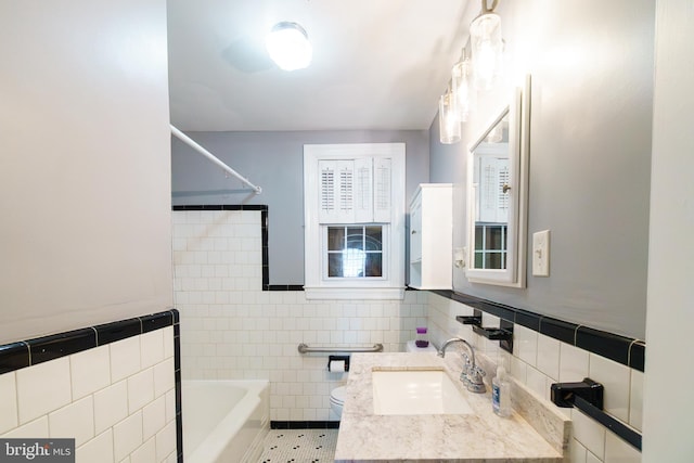 6 Carroll Rd, Catonsville, MD 21228 - full bath featuring tile walls, vanity, washtub / shower combination, and wainscoting