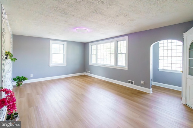 6 Carroll Rd, Catonsville, MD 21228 - unfurnished room with a textured ceiling and light wood-style flooring