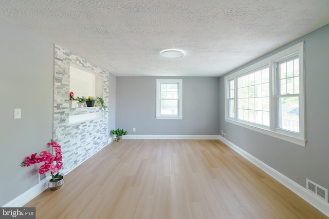 6 Carroll Rd, Catonsville, MD 21228 - spare room with light wood-style floors and a textured ceiling