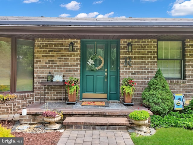 20412 Holt Cir, Hagerstown, MD 21742 - doorway to property featuring brick siding and covered porch