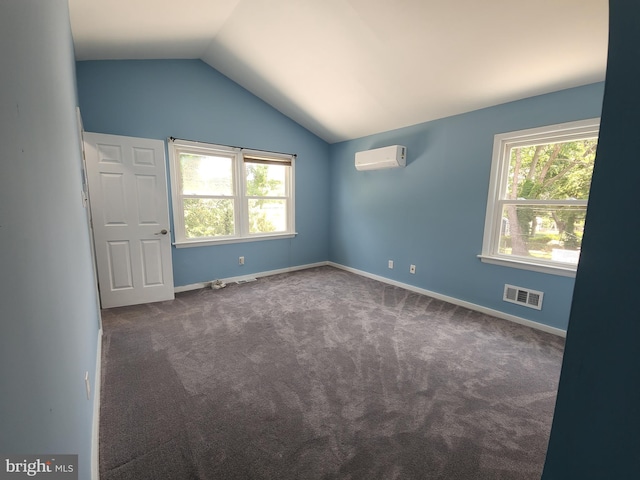 2258 Arlington Ter, Alexandria, VA 22303 - carpeted empty room featuring an AC wall unit and vaulted ceiling