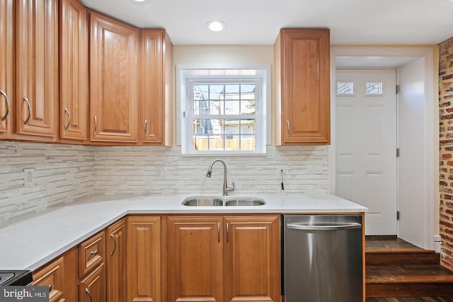 244 N Rose St, Baltimore, MD 21224 - kitchen with dishwasher, tasteful backsplash, light countertops, and brown cabinetry
