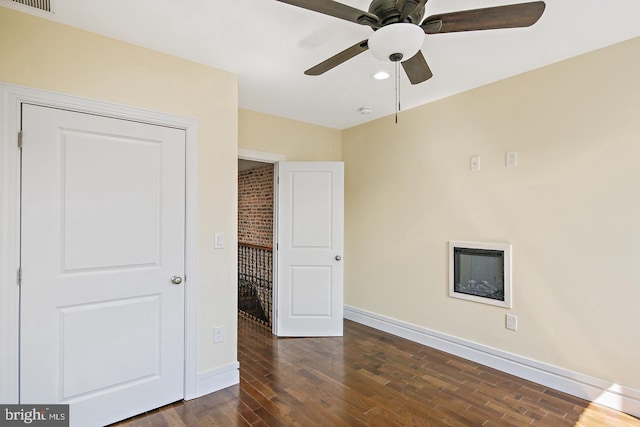 244 N Rose St, Baltimore, MD 21224 - unfurnished bedroom with dark wood-style flooring, a ceiling fan, and recessed lighting