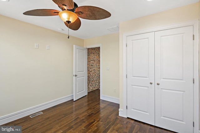 244 N Rose St, Baltimore, MD 21224 - unfurnished bedroom with dark wood-style flooring, a closet, and ceiling fan