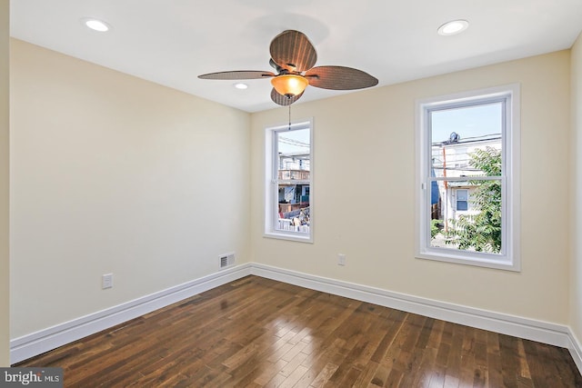 244 N Rose St, Baltimore, MD 21224 - unfurnished room featuring plenty of natural light, dark wood finished floors, ceiling fan, and recessed lighting