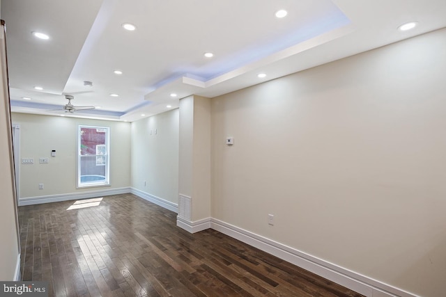 244 N Rose St, Baltimore, MD 21224 - spare room with a raised ceiling, dark wood finished floors, a ceiling fan, and recessed lighting