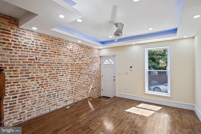 244 N Rose St, Baltimore, MD 21224 - foyer entrance featuring a tray ceiling, ceiling fan, brick wall, wood finished floors, and recessed lighting