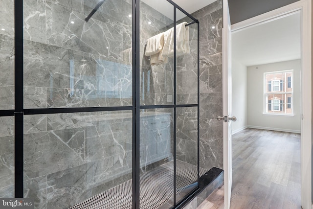 19278 Harlow Sq, Leesburg, VA 20176 - bathroom featuring a marble finish shower and wood finished floors