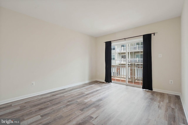 19278 Harlow Sq, Leesburg, VA 20176 - spare room featuring wood finished floors and baseboards
