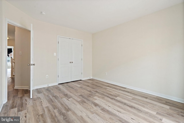 19278 Harlow Sq, Leesburg, VA 20176 - unfurnished bedroom featuring light wood-type flooring and a closet