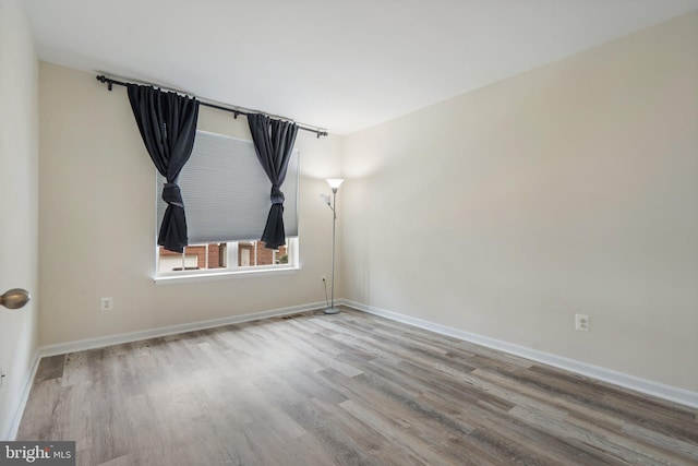 19278 Harlow Sq, Leesburg, VA 20176 - unfurnished room featuring wood finished floors and baseboards