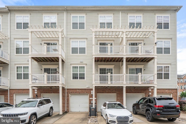 19278 Harlow Sq, Leesburg, VA 20176 - view of front of home with a garage, driveway, and brick siding