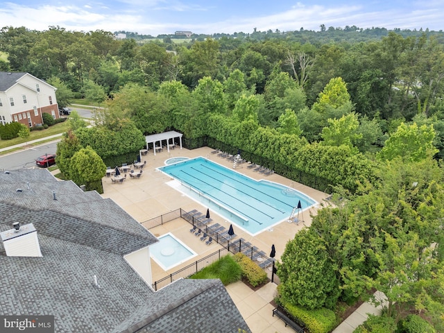 19278 Harlow Sq, Leesburg, VA 20176 - community pool featuring a patio and a forest view