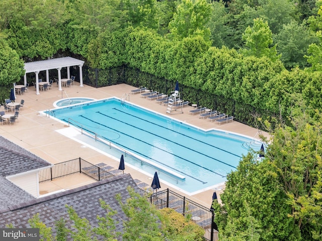 19278 Harlow Sq, Leesburg, VA 20176 - community pool featuring a hot tub, a patio area, and a forest view