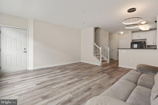 19278 Harlow Sq, Leesburg, VA 20176 - living area with stairs and light wood-type flooring