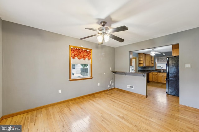 739 Brooke Cir, Morton, PA 19070 - unfurnished living room featuring a ceiling fan and light wood-style flooring