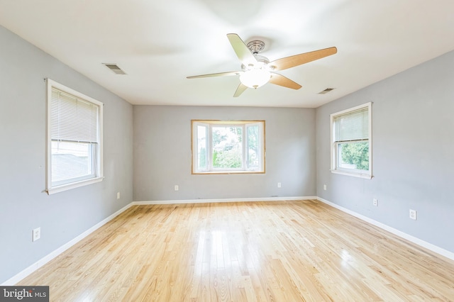 739 Brooke Cir, Morton, PA 19070 - empty room with plenty of natural light, a ceiling fan, and wood finished floors