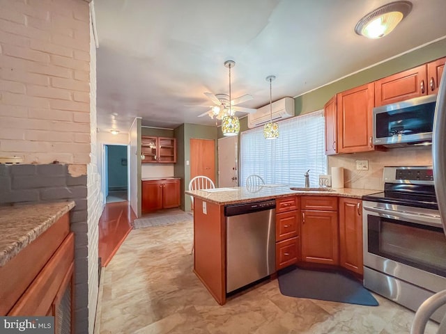 237 Lakeside Dr Unit N, Levittown, PA 19054 - kitchen with appliances with stainless steel finishes, a wall mounted AC, a peninsula, ceiling fan, and hanging light fixtures