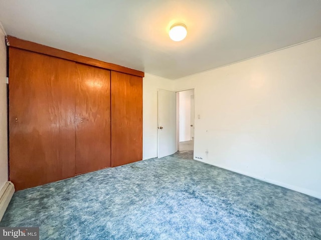 237 Lakeside Dr Unit N, Levittown, PA 19054 - unfurnished bedroom with carpet floors, a closet, and a baseboard heating unit