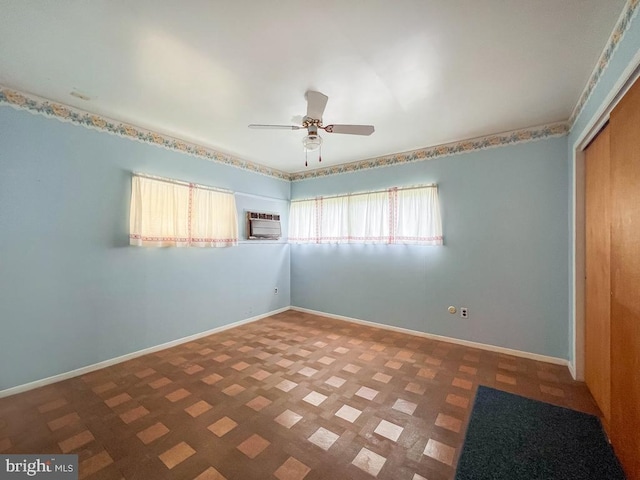 237 Lakeside Dr Unit N, Levittown, PA 19054 - unfurnished bedroom featuring a wall mounted AC, a closet, and ceiling fan