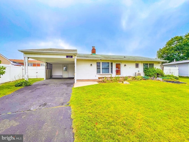 237 Lakeside Dr Unit N, Levittown, PA 19054 - view of front of home featuring driveway, a chimney, and an attached carport