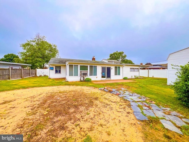 237 Lakeside Dr Unit N, Levittown, PA 19054 - rear view of house featuring a fenced backyard, a patio, and a chimney