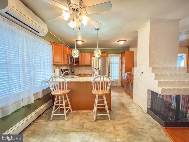 237 Lakeside Dr Unit N, Levittown, PA 19054 - kitchen with a wall mounted air conditioner, appliances with stainless steel finishes, a peninsula, ceiling fan, and healthy amount of natural light
