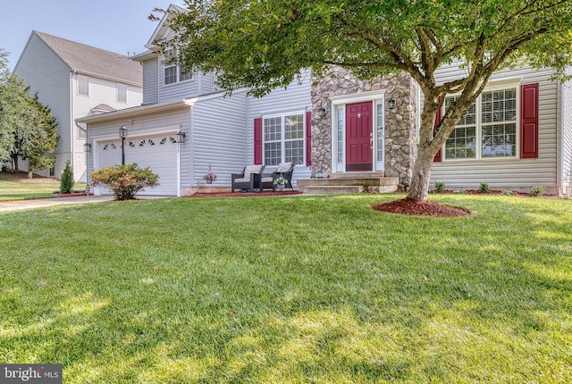 890 Ambleside Dr, Culpeper, VA 22701 - view of front of home with a front yard, stone siding, and driveway