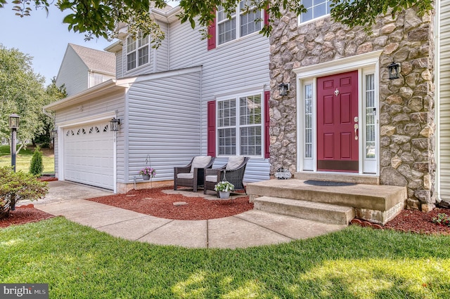 890 Ambleside Dr, Culpeper, VA 22701 - view of exterior entry featuring stone siding, driveway, and a lawn