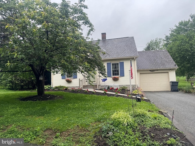 18 Benedict Rd, Lancaster, PA 17603 - view of front of property featuring a garage, driveway, a front yard, and a chimney