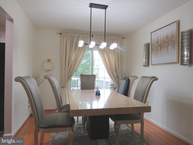 12310 Herrington Manor Dr, Silver Spring, MD 20904 - dining area featuring wood finished floors and a chandelier