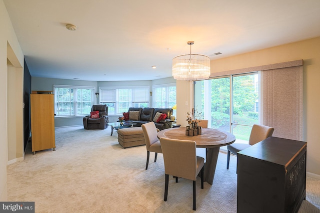 9209 Howard Square Dr Unit 9209, Pikesville, MD 21208 - dining area with healthy amount of natural light, a chandelier, and light colored carpet