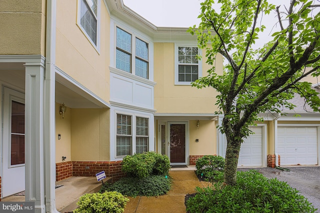 9209 Howard Square Dr Unit 9209, Pikesville, MD 21208 - multi unit property featuring stucco siding, a garage, and brick siding