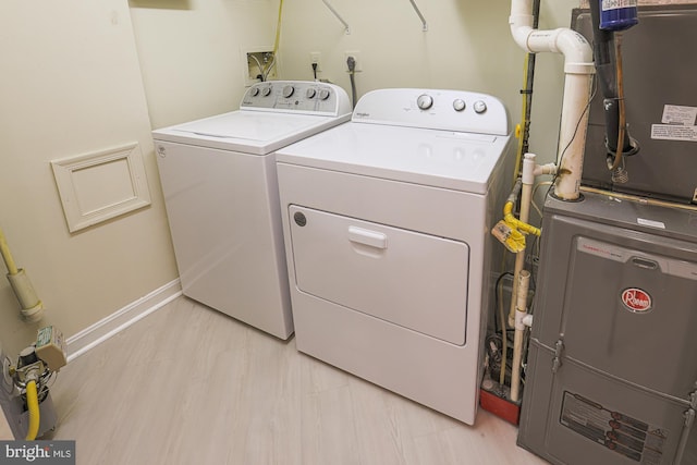 9209 Howard Square Dr Unit 9209, Pikesville, MD 21208 - laundry room with washing machine and clothes dryer and heating unit