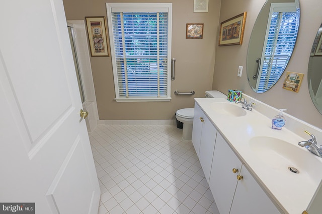 9209 Howard Square Dr Unit 9209, Pikesville, MD 21208 - full bath featuring double vanity, tile patterned flooring, and a shower with door