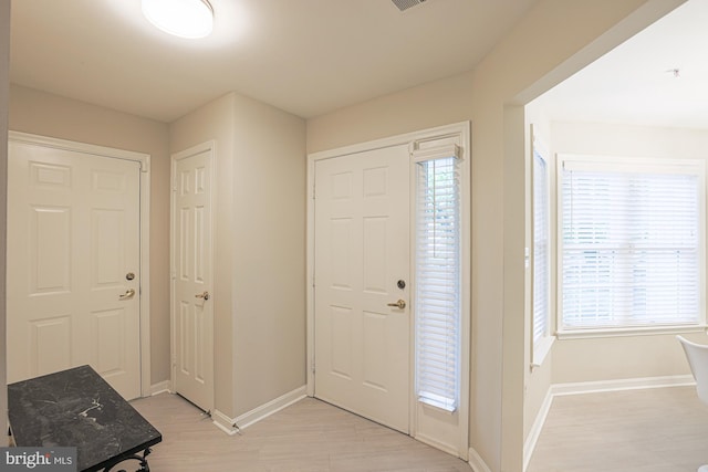 9209 Howard Square Dr Unit 9209, Pikesville, MD 21208 - entryway with baseboards and light wood finished floors