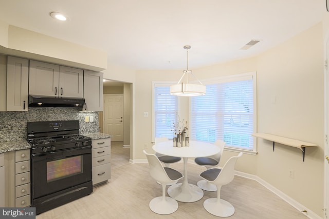 9209 Howard Square Dr Unit 9209, Pikesville, MD 21208 - kitchen with black gas range, under cabinet range hood, gray cabinetry, light wood-type flooring, and recessed lighting