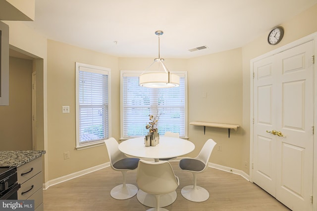 9209 Howard Square Dr Unit 9209, Pikesville, MD 21208 - dining space featuring light wood-style flooring and baseboards