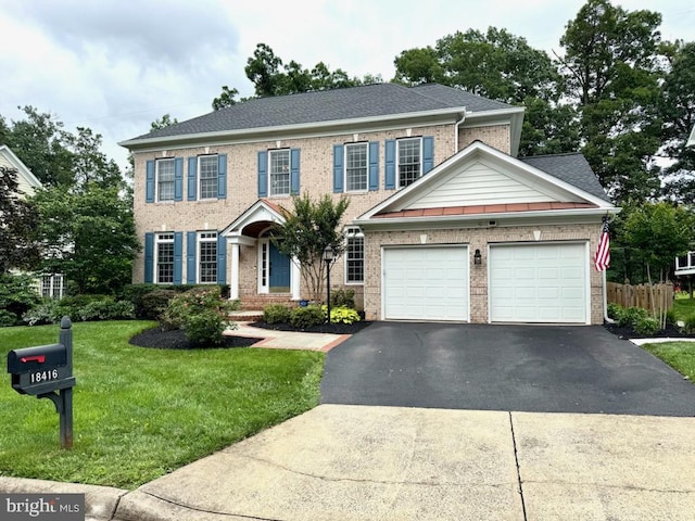 18416 Mill Run Ct, Leesburg, VA 20176 - view of front facade with asphalt driveway, brick siding, a garage, and a shingled roof
