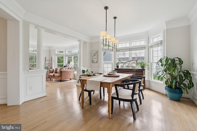 18416 Mill Run Ct, Leesburg, VA 20176 - dining space with ornate columns, a decorative wall, ornamental molding, light wood-style floors, and wainscoting
